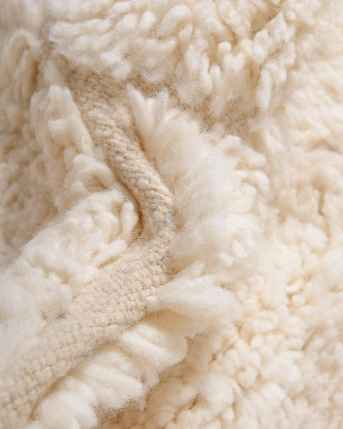 Modern, designer, handcrafted Berber rug from Morocco. Beniourain carpet with minimalist design, natural wool pile and a fluffy texture.